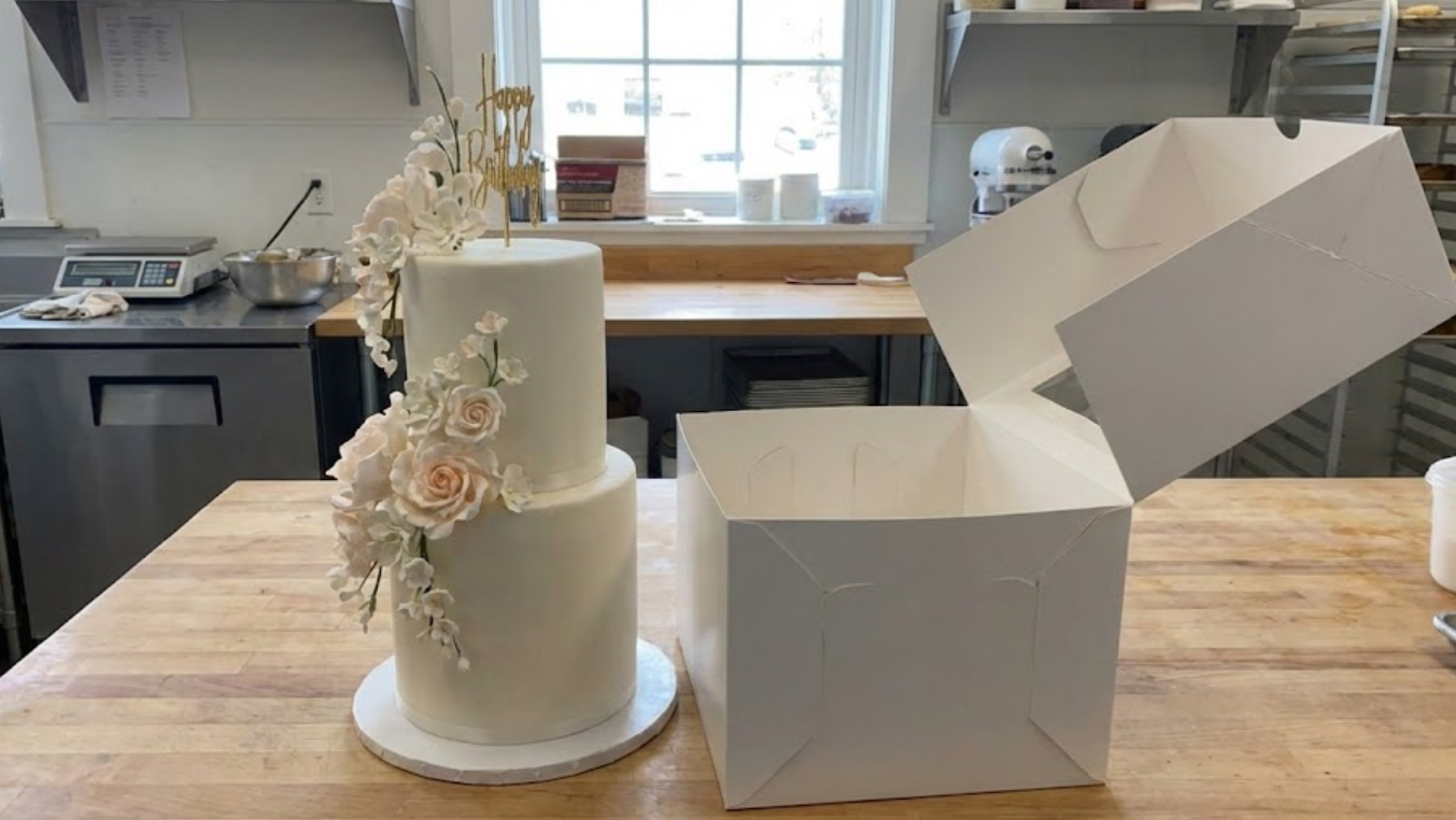 Custom tall birthday cakes cannot fit into standard-sized cake boxes.